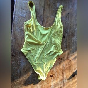 “Havana Club” one piece. High on hip, low back, showy on butt.